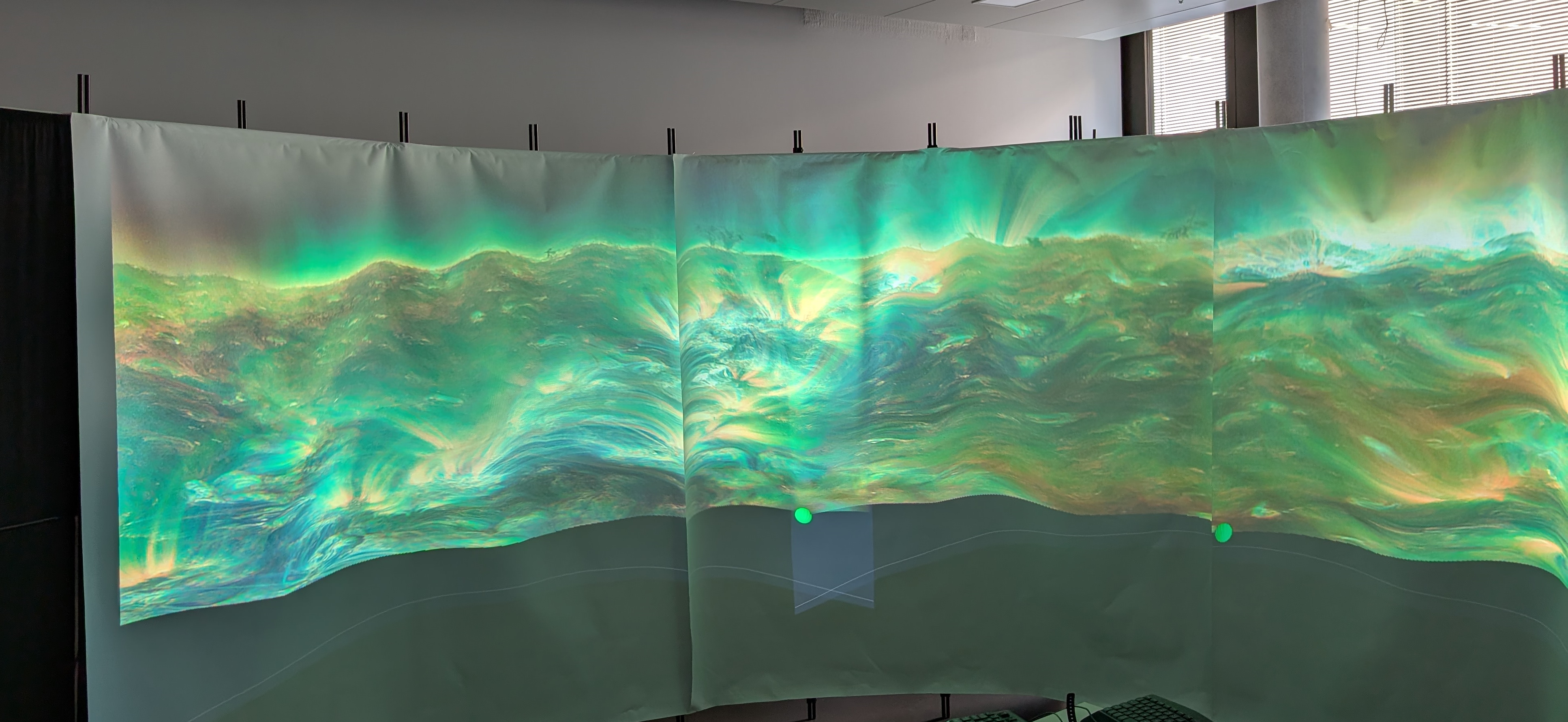 Image of a video generated by the reference implementation being projected onto a make-shift cylindrical screen