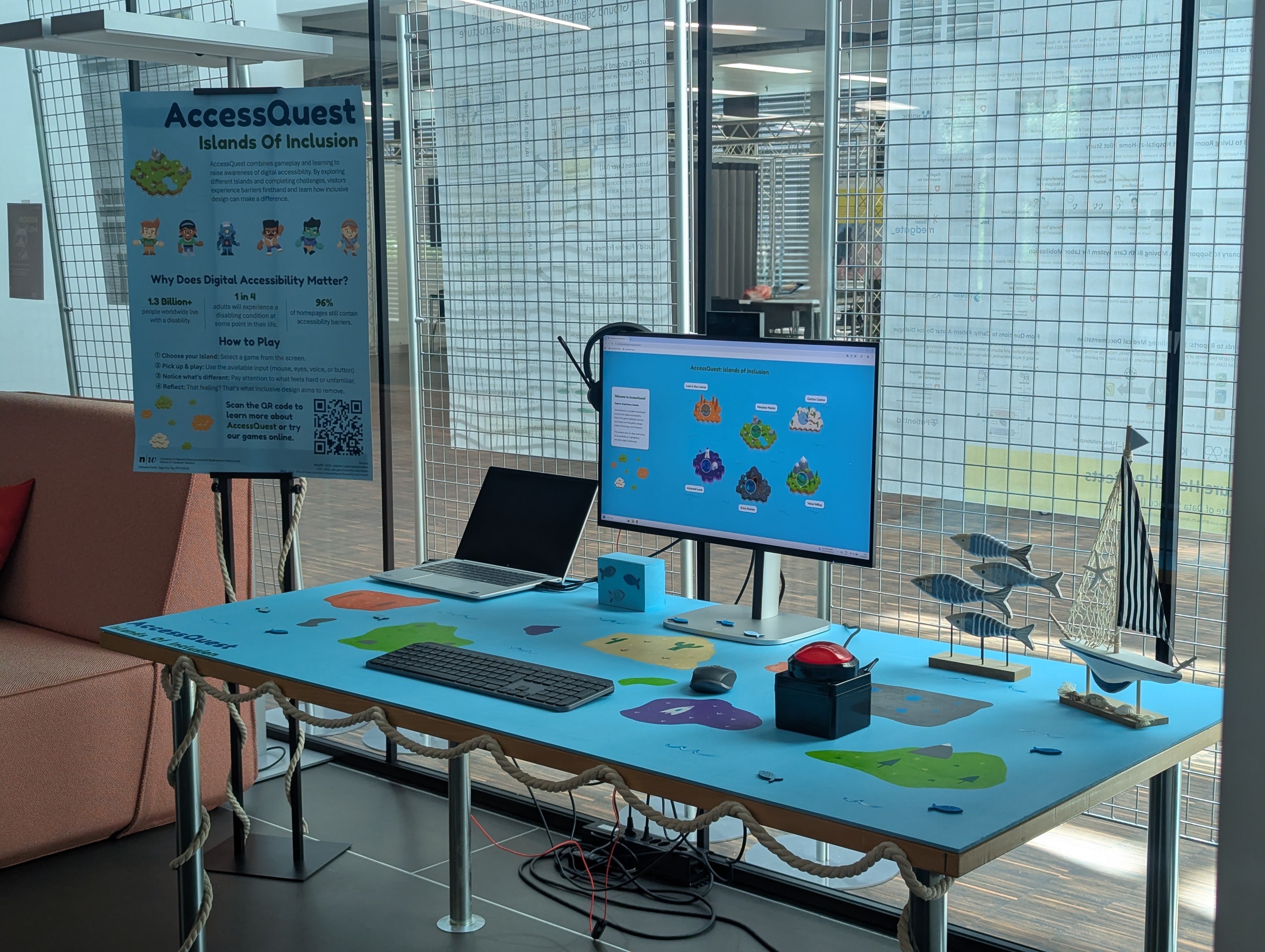 The AccessQuest physical workstation at FHNW Brugg-Windisch, featuring a monitor with the game interface and custom input devices.